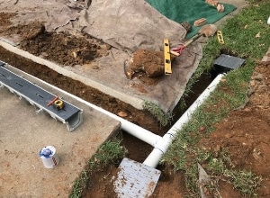 PVC Pipe and Two Surface Drains in the Trench