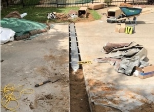 Installing the Channel Drain and Filled the Trench with Dirt