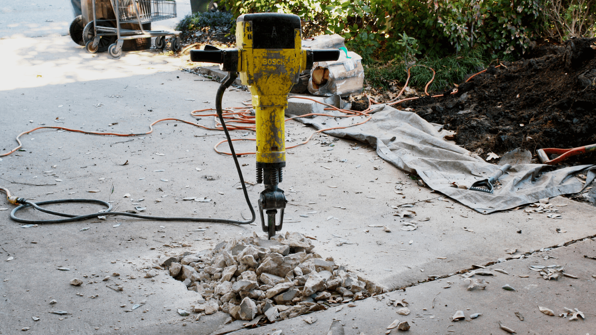 Jackhammer being used for drilled pier foundation repair